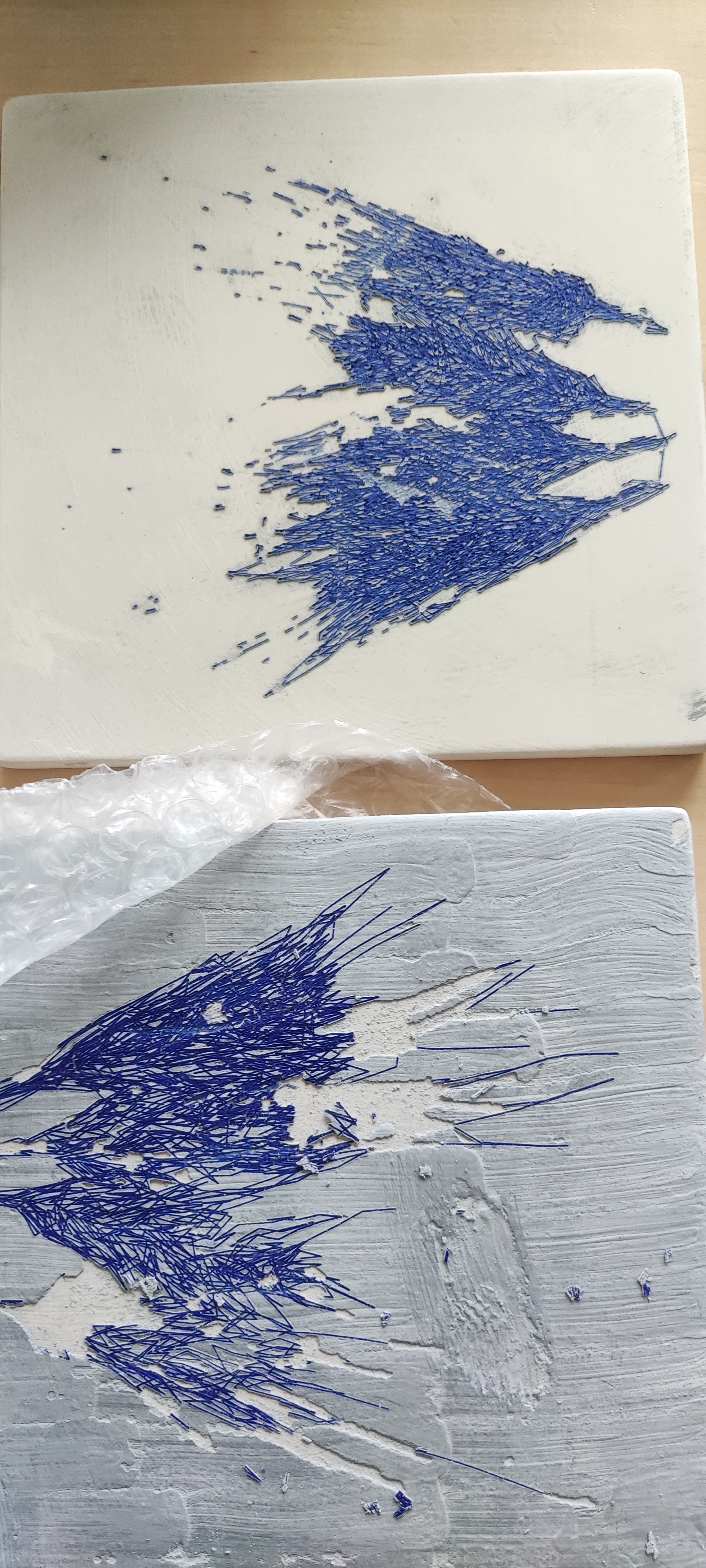 Same tile after second glaze layer and fire. Two distinct colours in close registration.