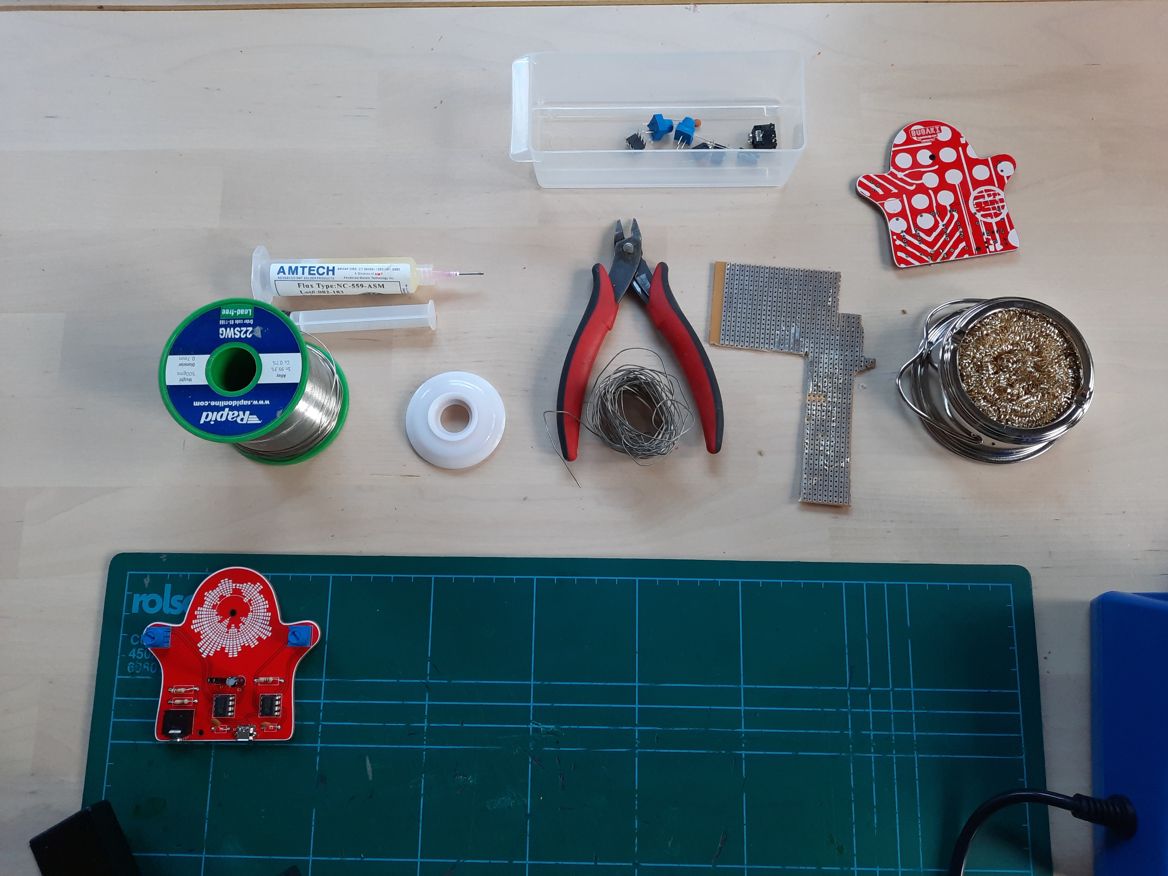 Sound Through Surfaces, 555-timer PCB soldering workshop, participants at benches.