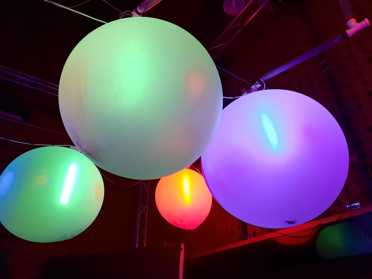 Speech Bubbles, illuminated speech-bubble forms in a public park, night-time light and sound.